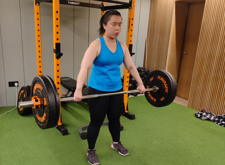 Lady lifting heavy weight